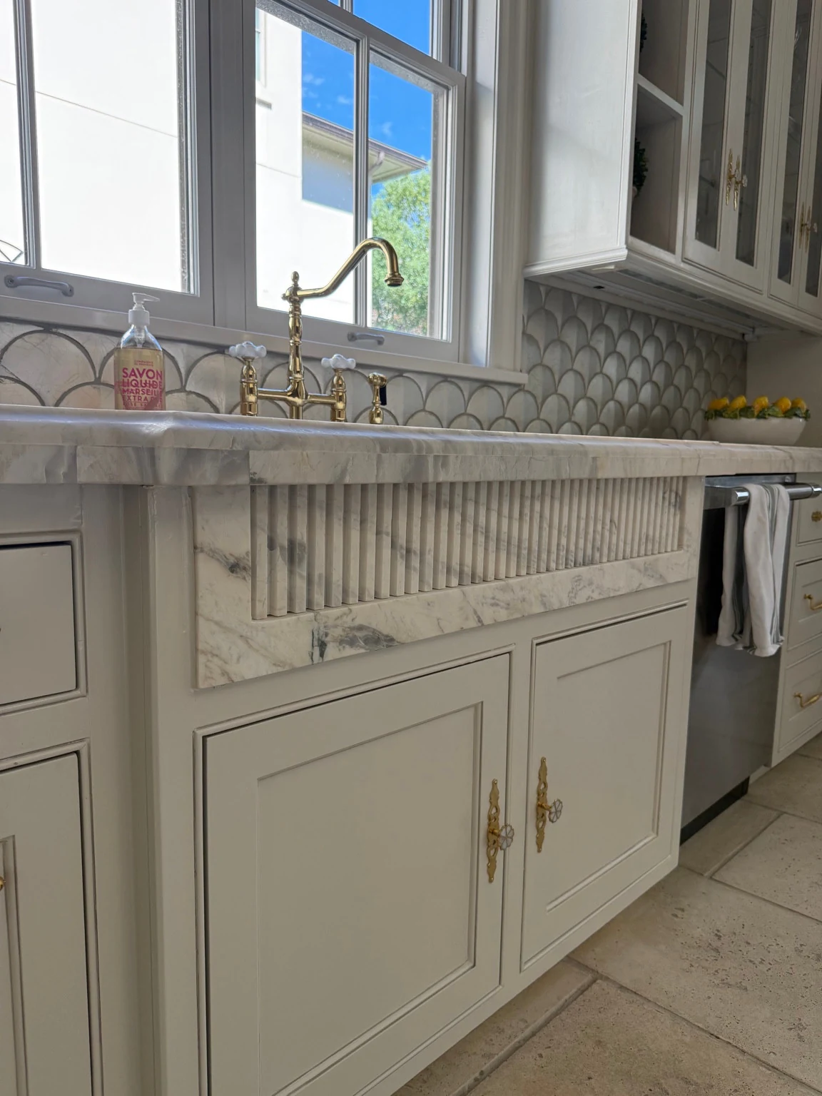 Calacatta Manhattan quartzite, showing the custom fluted sink apron designed by StoneLux